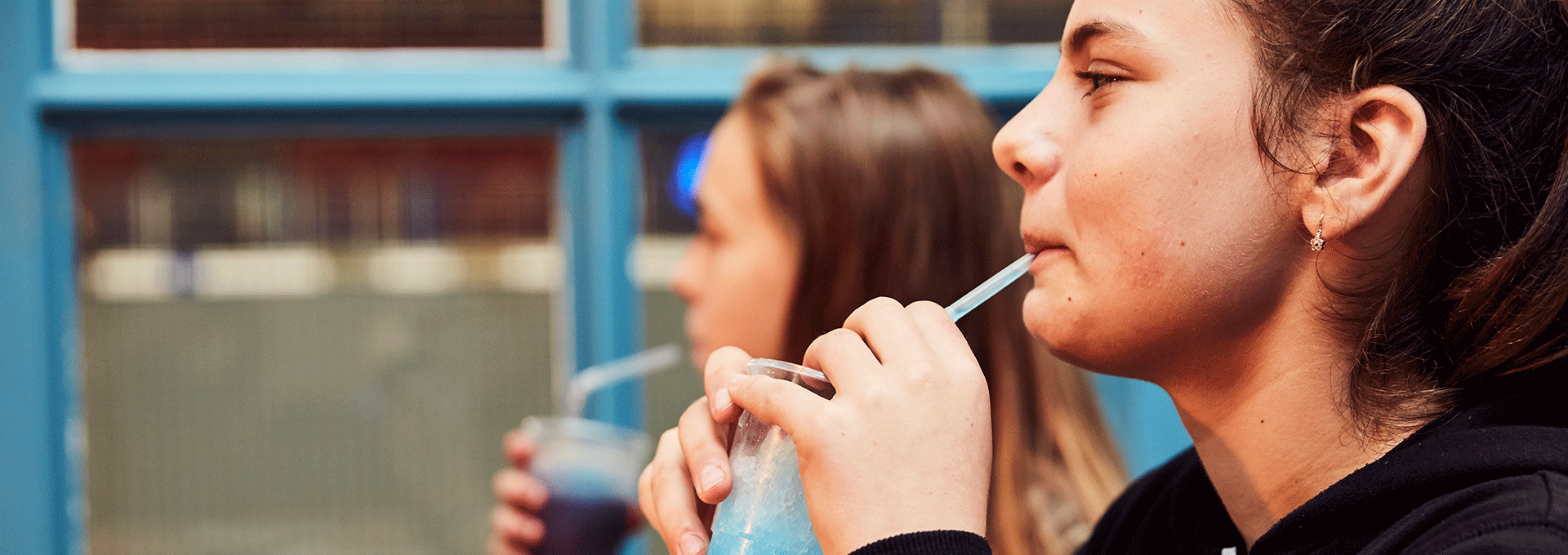 Girls sipping iced drinks at the ice cafe