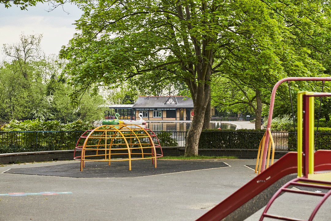 A climbing frame and a slide in the children's playground on a sunny day.