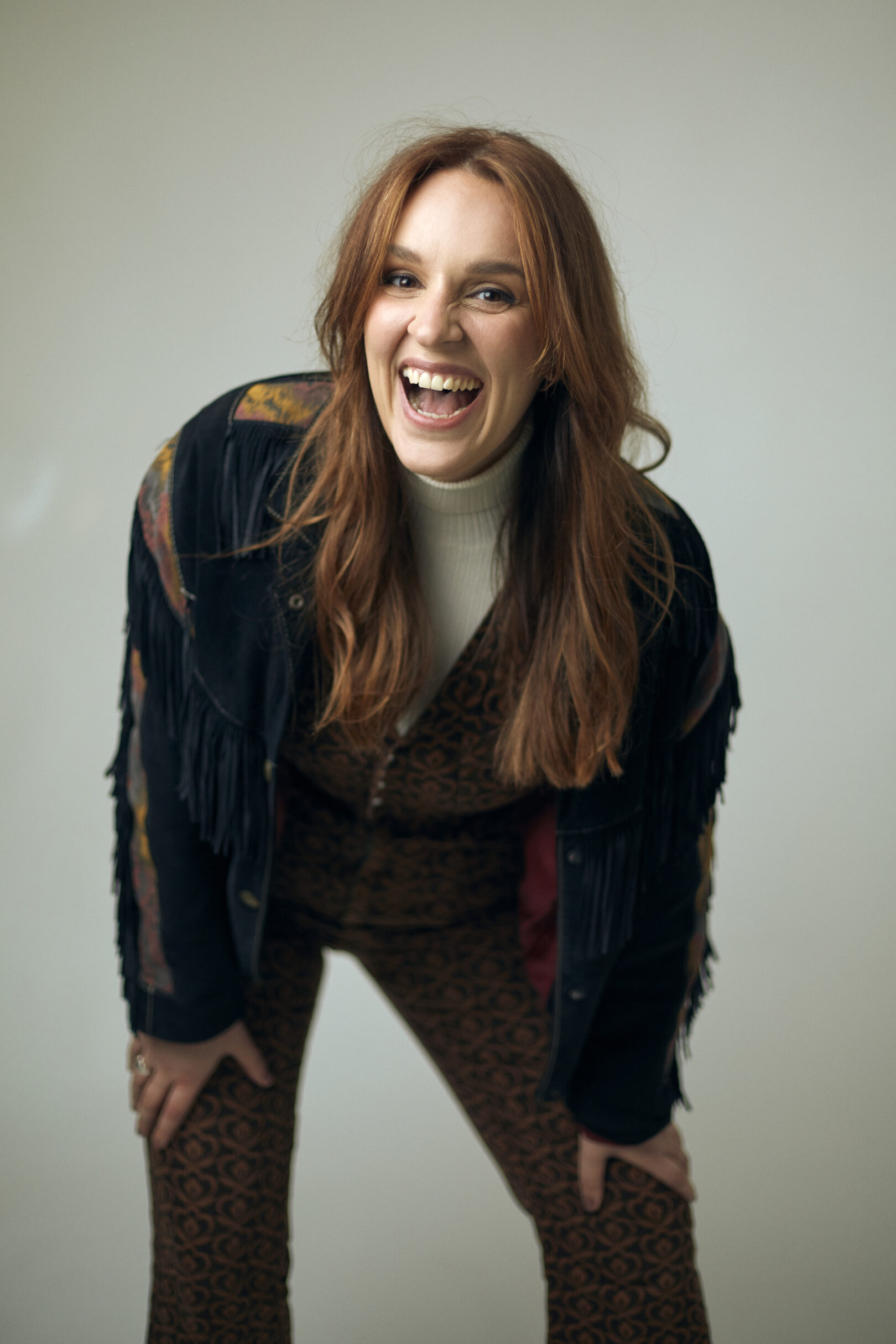 A headshot of stand-up comedian, actress and singer, Katie Norris.